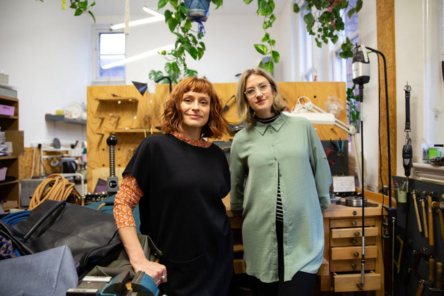 Studio Ditto founders in jewellery/bag workshop