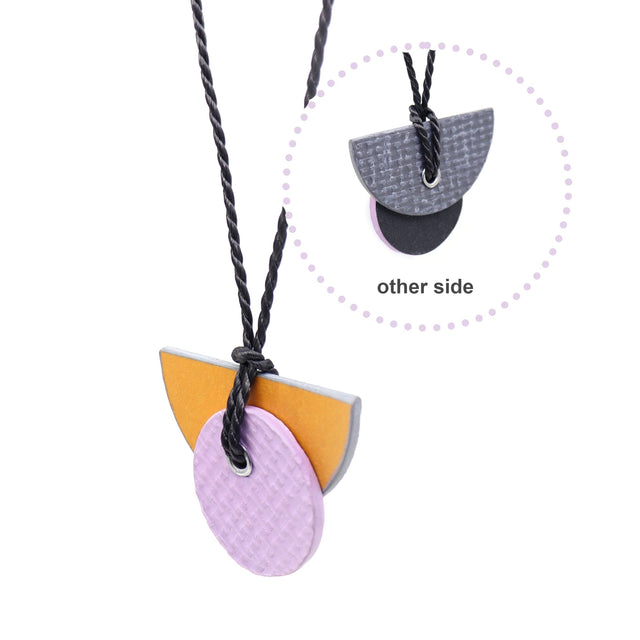Linoleum orange & lilac reversible necklace on grey twisted string