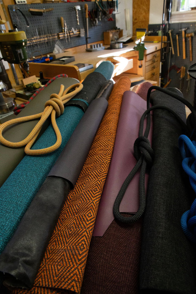 rolls of upholstery on a jewellers bench