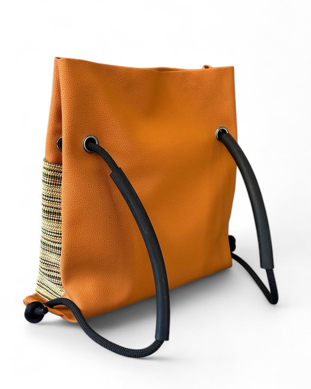 orange striped sustainable ditto convertible backpack with upcycled climbing rope and reclaimed materials