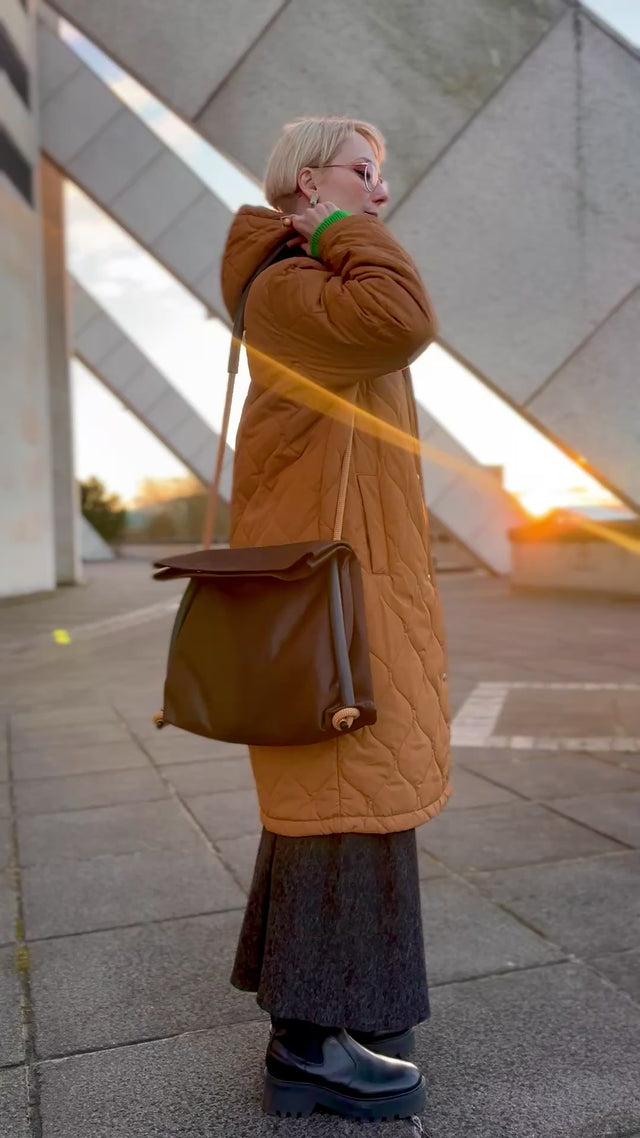 brown faux nubuck pleather convertible bag going from shoulder to back