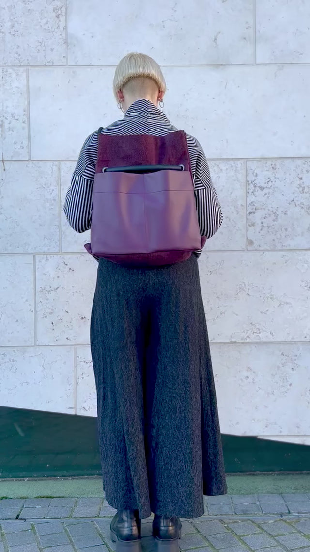 Plum chevron convertible bag from back to shoulder