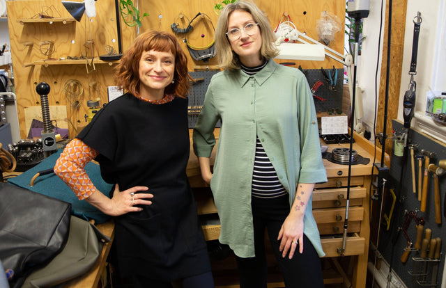 Founders of Studio Ditto standing in front of jewellers bench