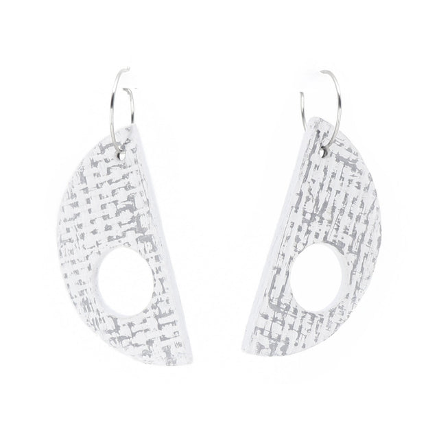 Pair of geometric earrings on a white background