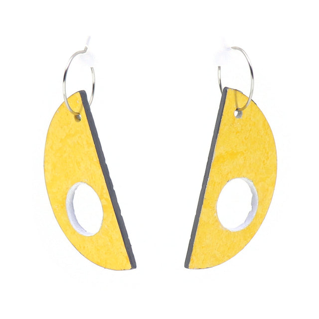 Yellow and black earrings with a white background