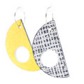 Pair of earrings with yellow and patterned gray designs on a white background