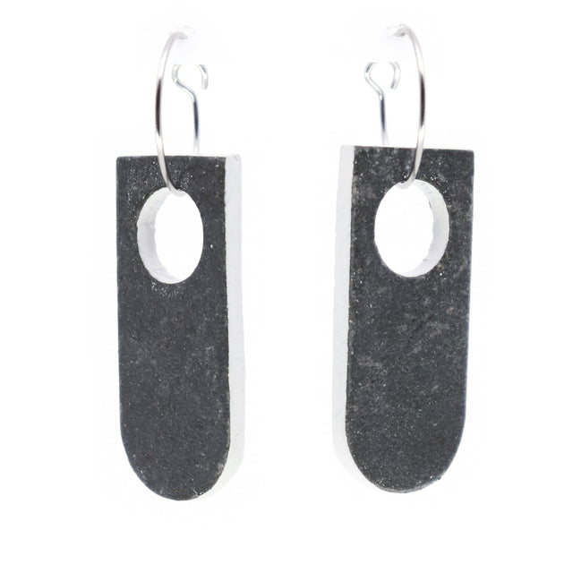 grey and white linoleum earrings on steel hoops with white background
