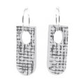 Pair of earrings with grey and white abstract design on a white background