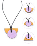 Linoleum orange & lilac pendant necklace can be worn many ways