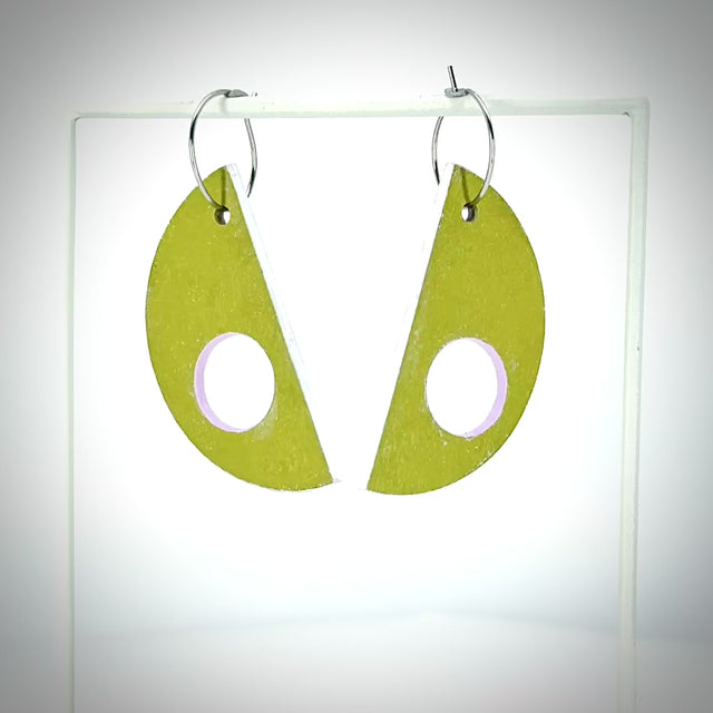 moss green D-shaped earrings rotating to show pink back